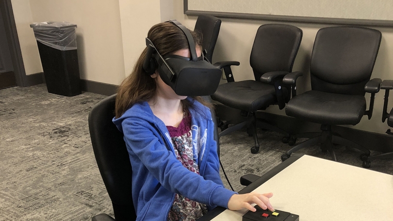 A research participant wears a mask to participate in a research project.